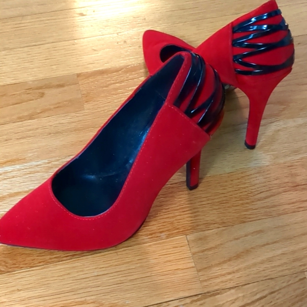 Red hot high heel pumps with black design in back